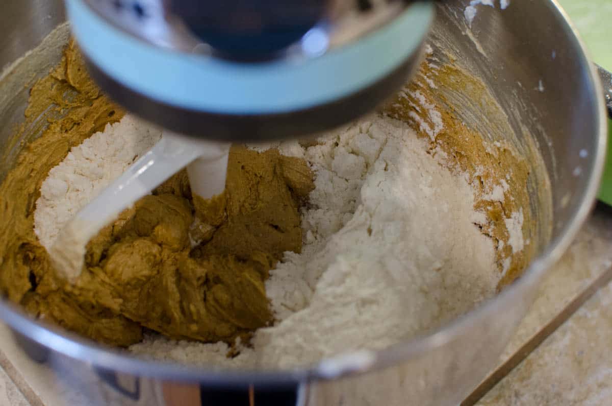 mixing gingerbread cookie ingredients in stand mixer