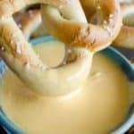 beer cheese dip with a pretzel