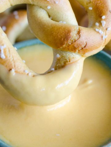 beer cheese dip with a pretzel