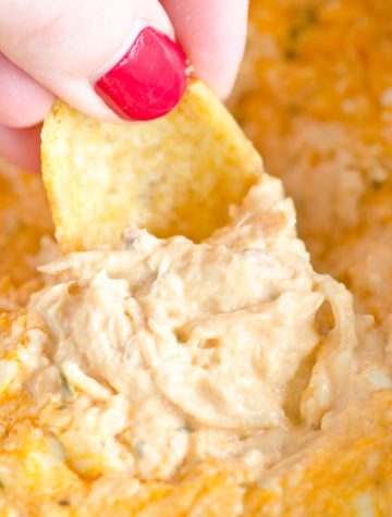 close up of buffalo chicken dip with frito scoop
