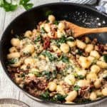 gnocchi in skillet with spinach and sausage