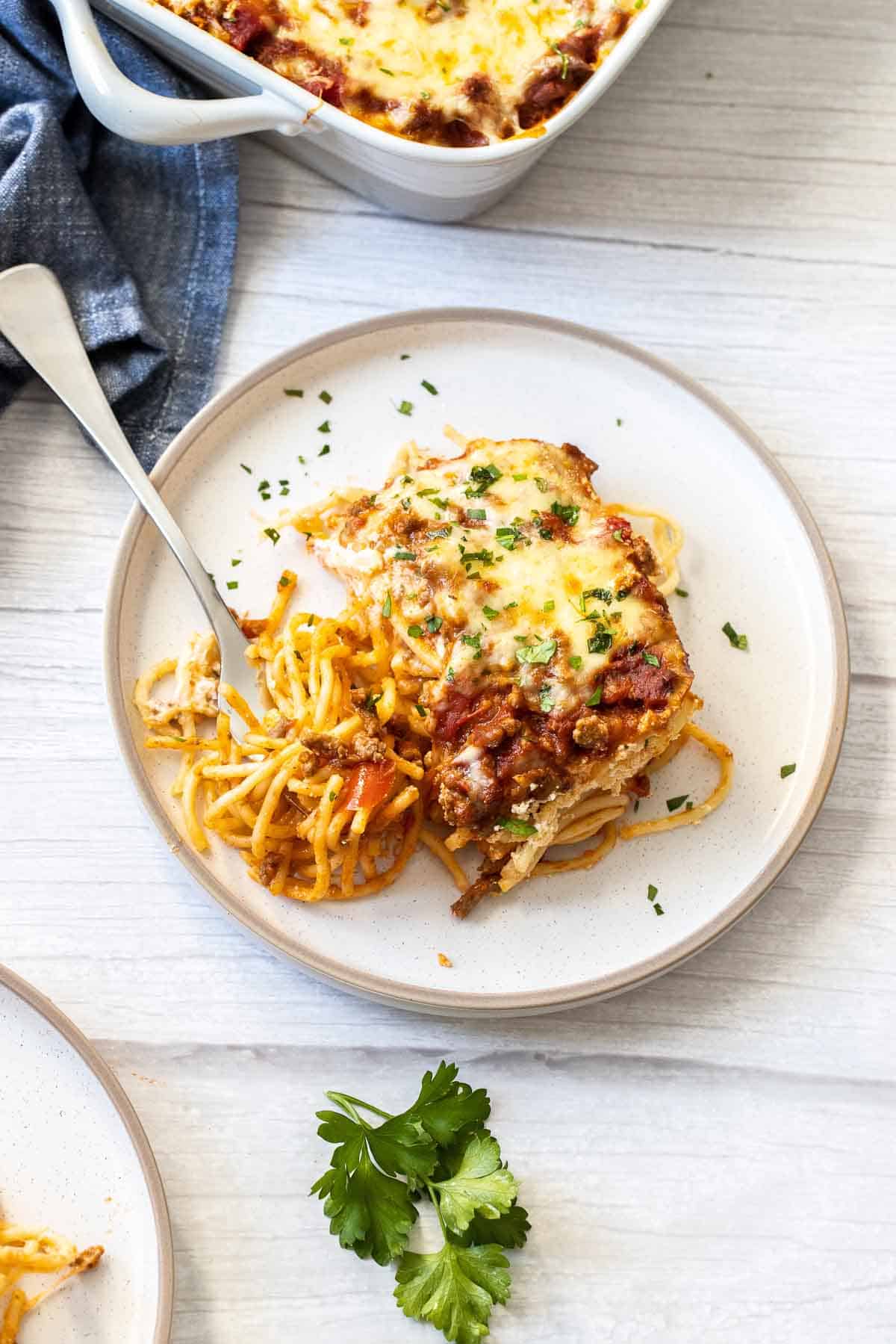 baked spaghetti on a plate with fork