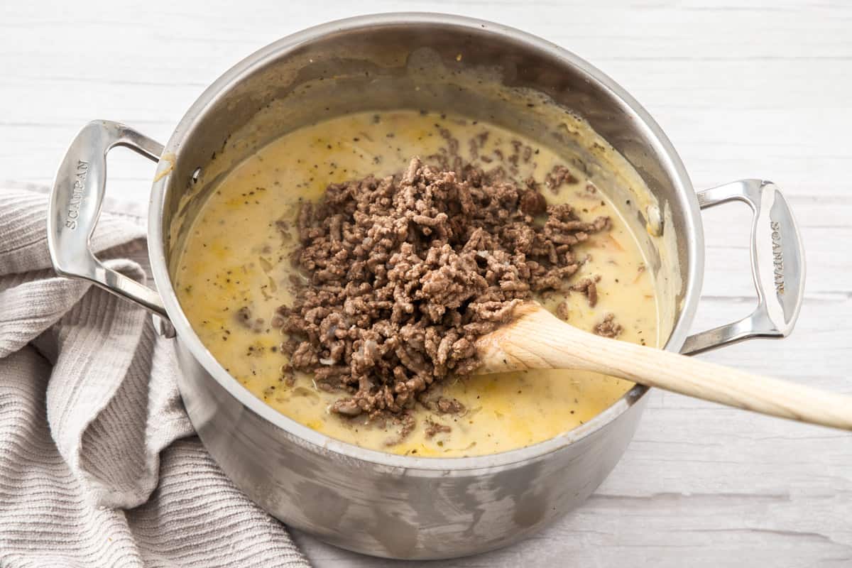 add beef into pot of cheeseburger soup