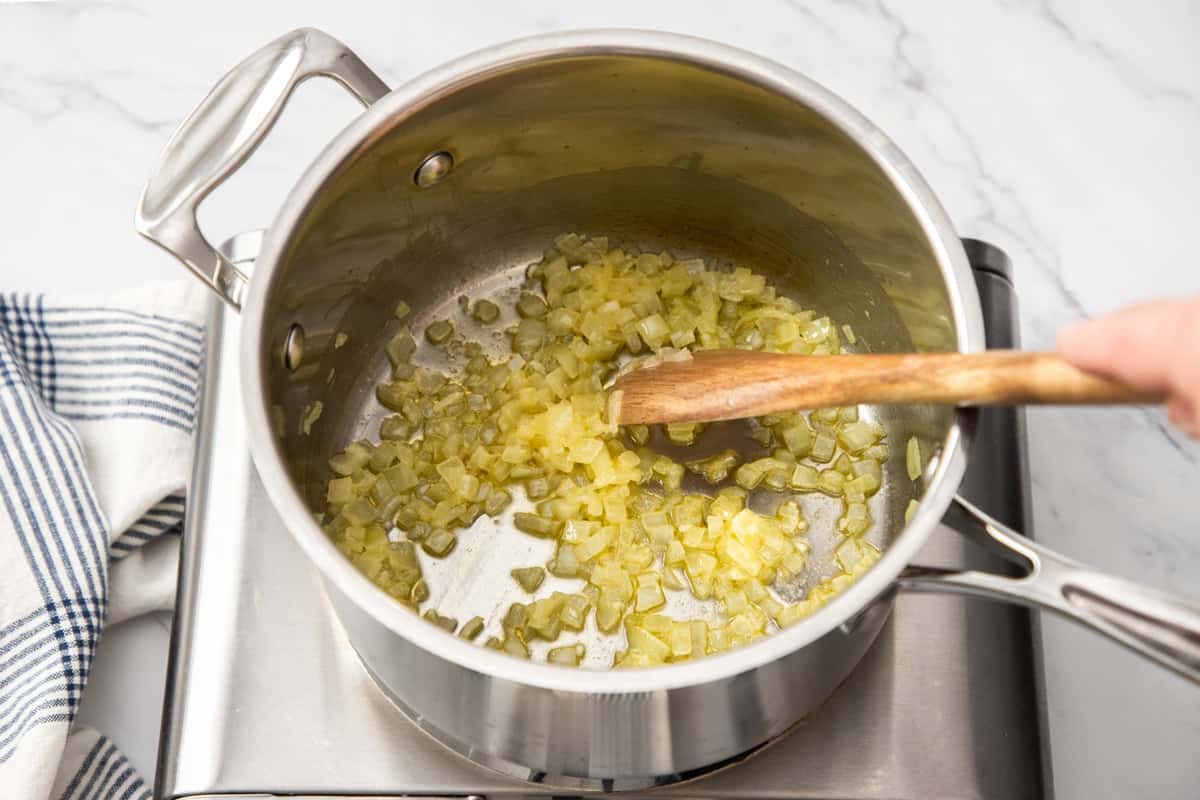 cooking onions and butter in pan on stovetop