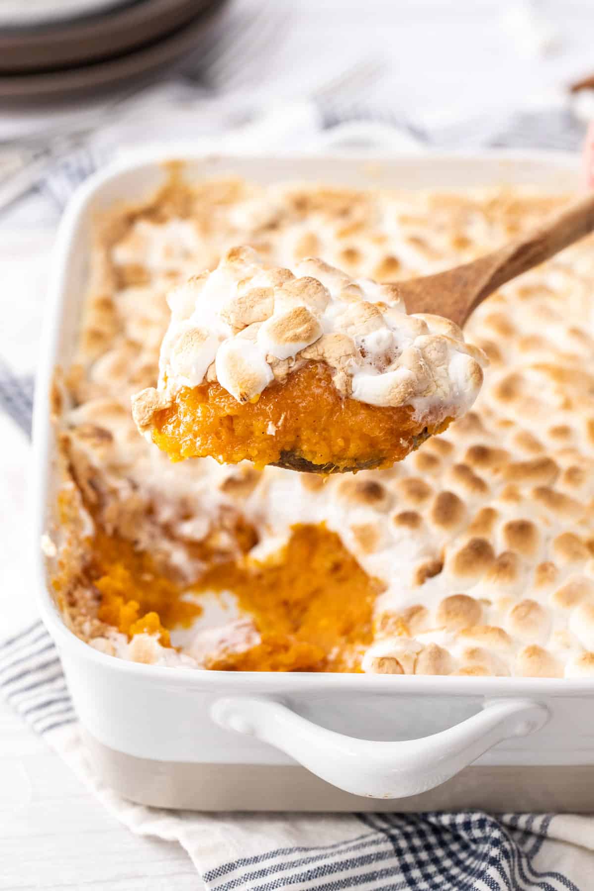 scoop of sweet potato casserole topped with marshmallows