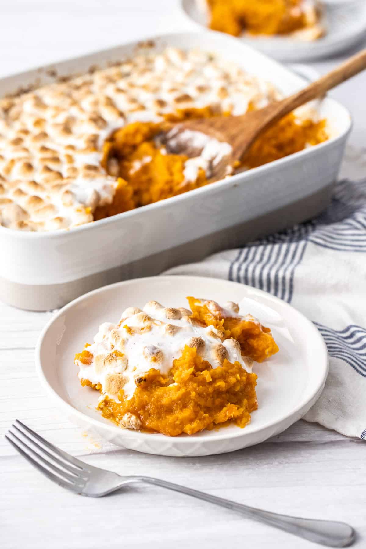 sweet potato casserole in casserole dish and plate with fork