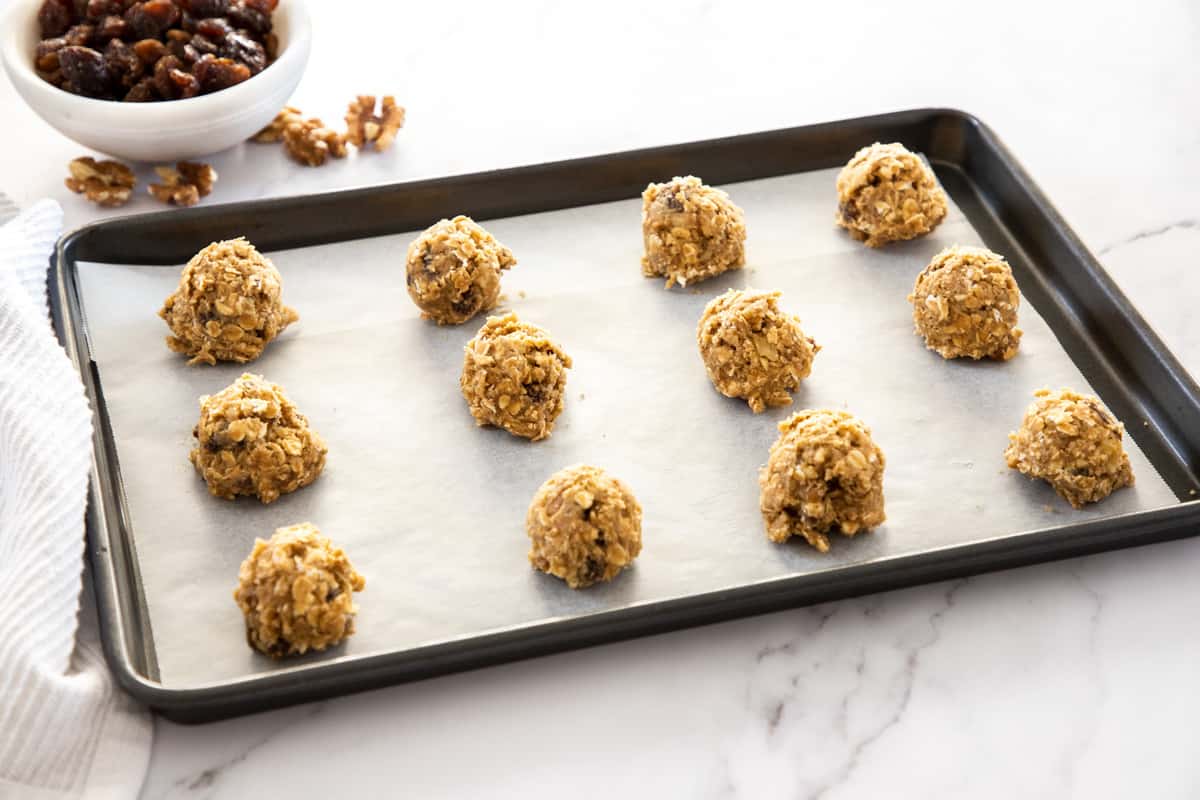 oatmeal cookie dough balls on baking sheet