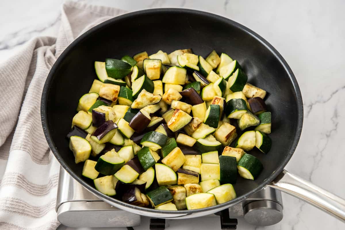chopped eggplant and zucchini in large skillet for ratatouille recipe