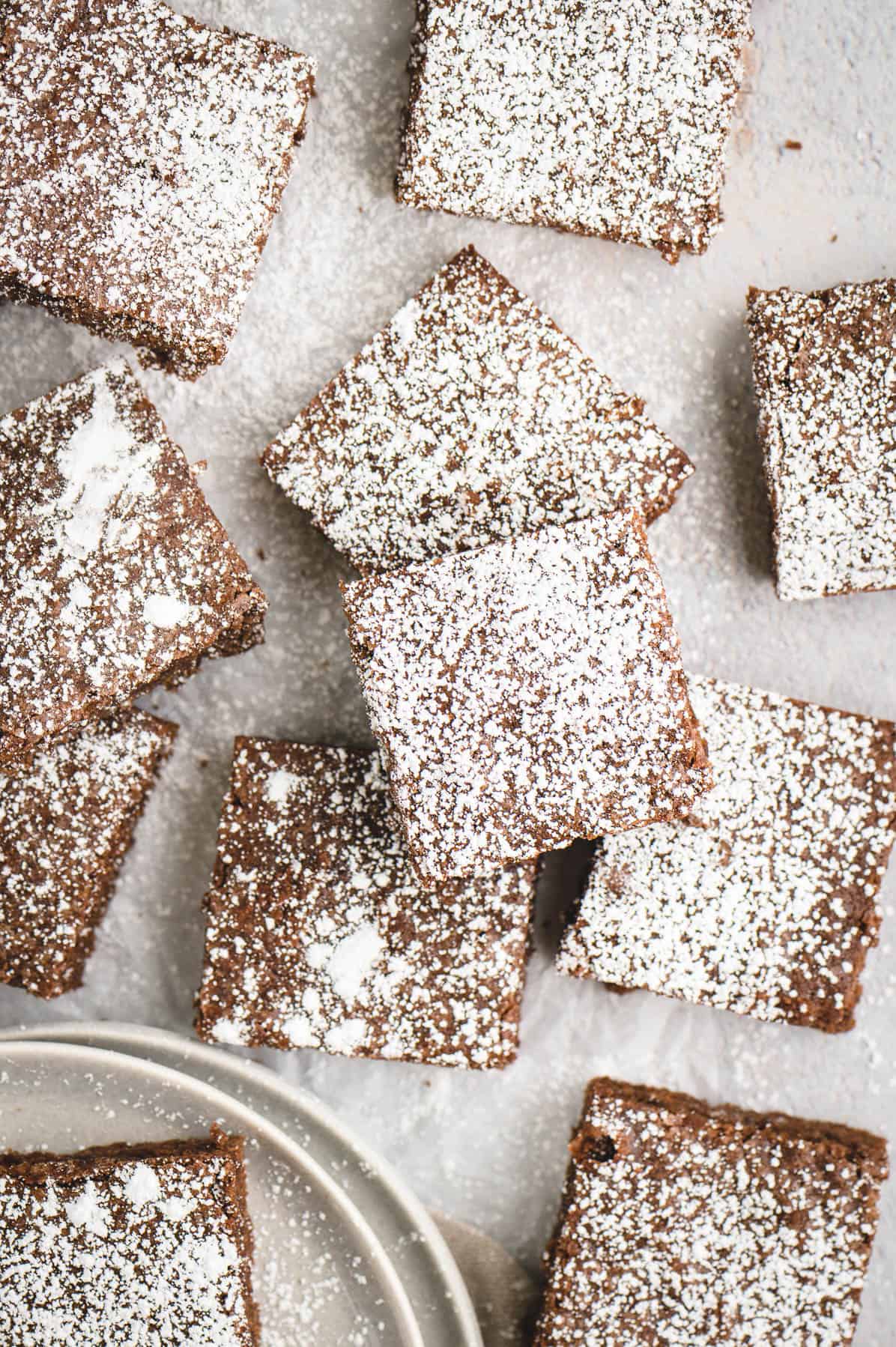 brownie squares topped with powdered sugar