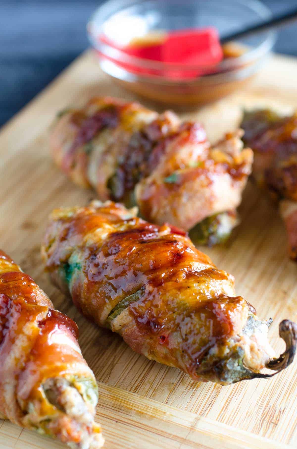 stuffed jalapenos wrapped in bacon and brushed with bbq sauce