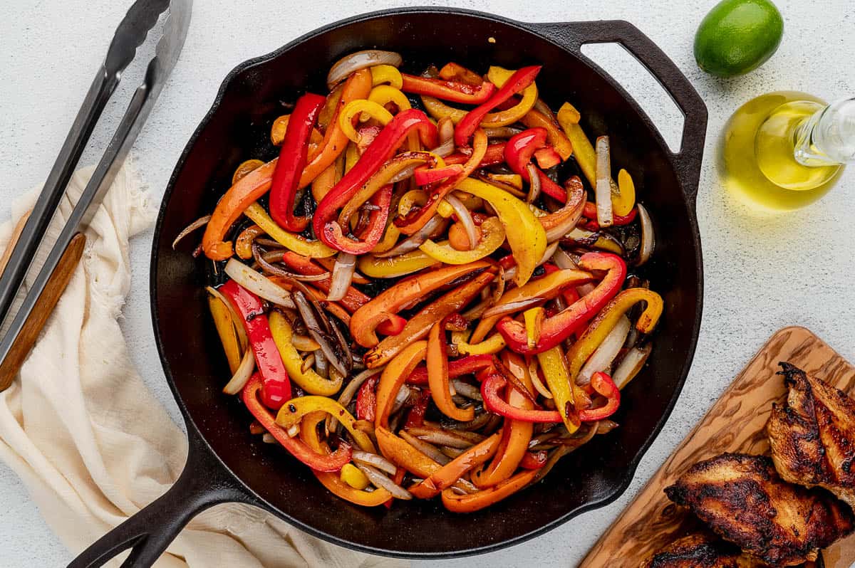 peppers sauteeing in cast iron skillet for fajita recipe