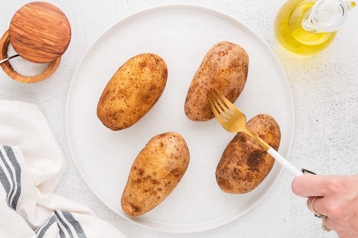 poke holes in potatoes with fork