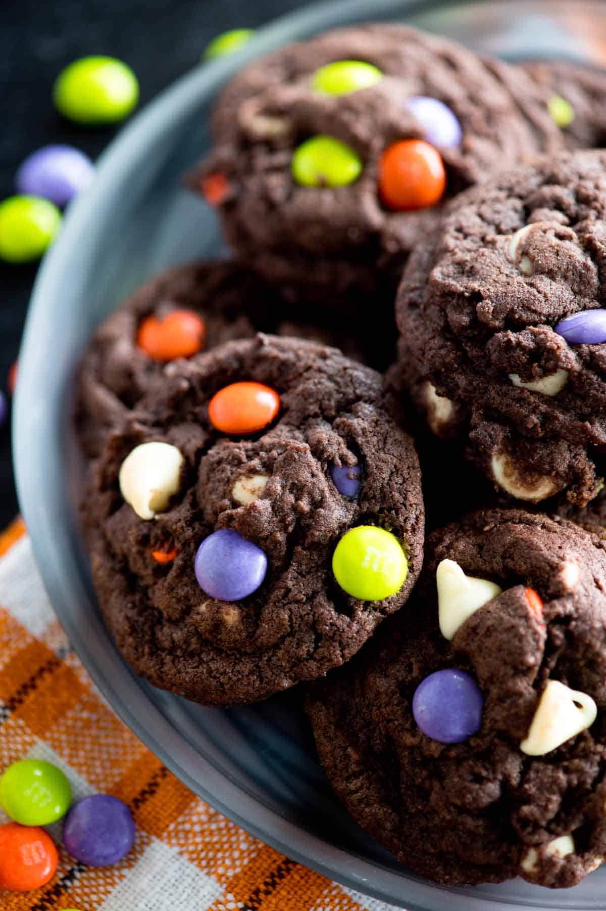 plate of chocolate cookies with halloween candies