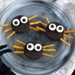 oreo cookies with pretzel stick spider legs and candy eyeballs