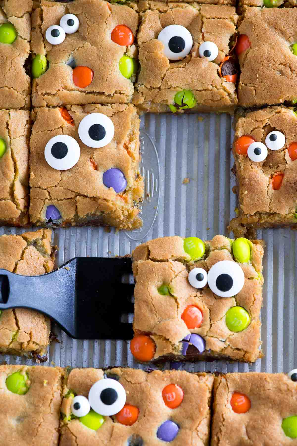 halloween cookie bars with m and m candies and googly eyes
