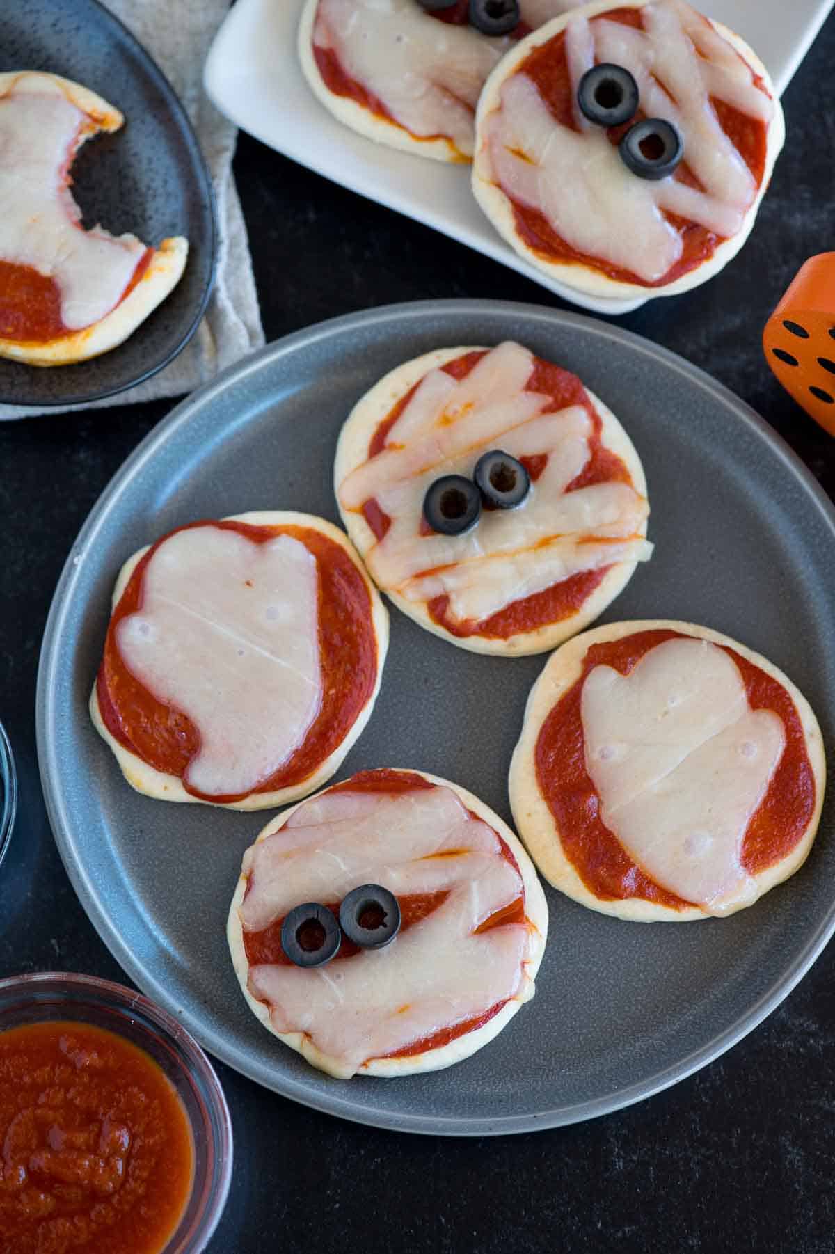 mini Halloween pizza snacks on a plate