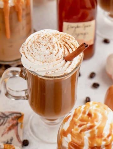 feature image of pumpkin spice latte recipe with whipped cream on top