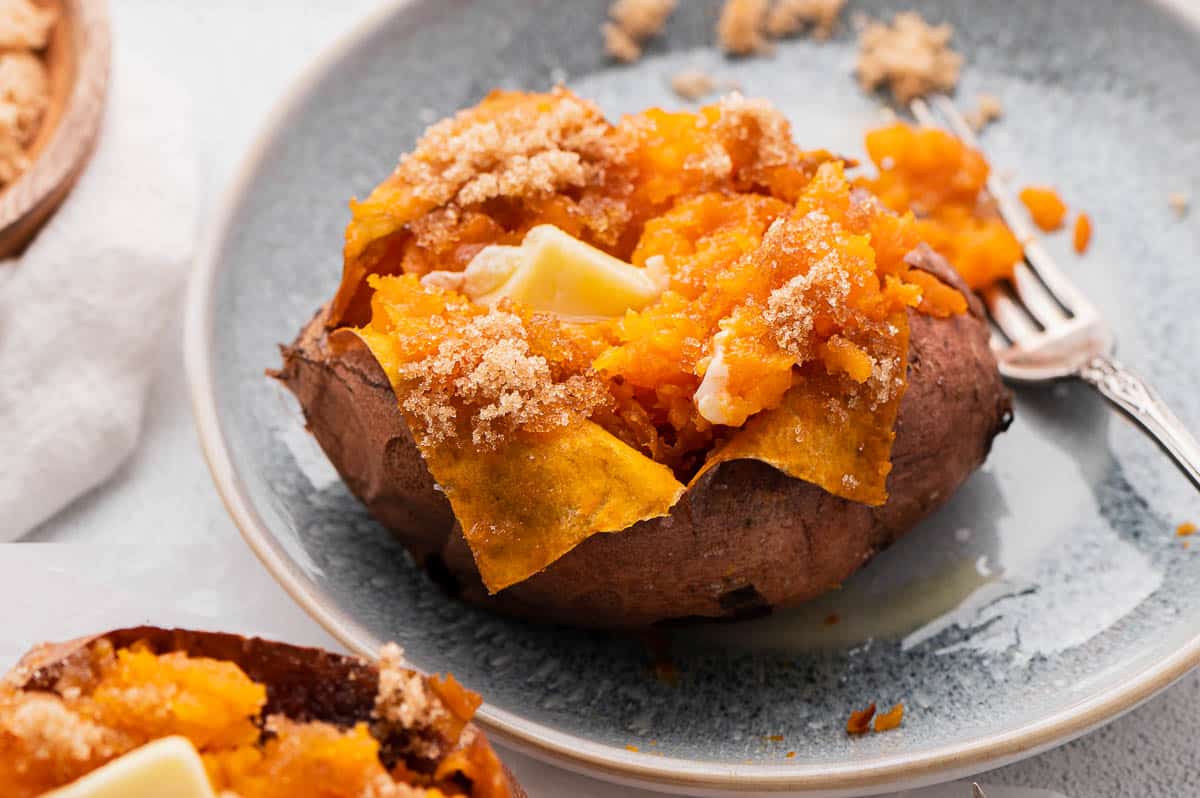fluffy baked sweet potato with melted butter