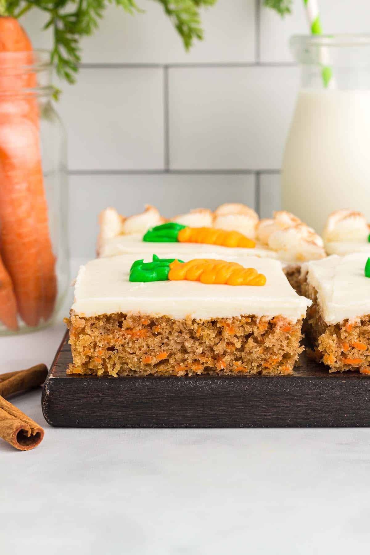 slices of carrot cake from a sheet pan