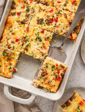 Easy sausage and hashbrown breakfast casserole baked in a 9×13 dish